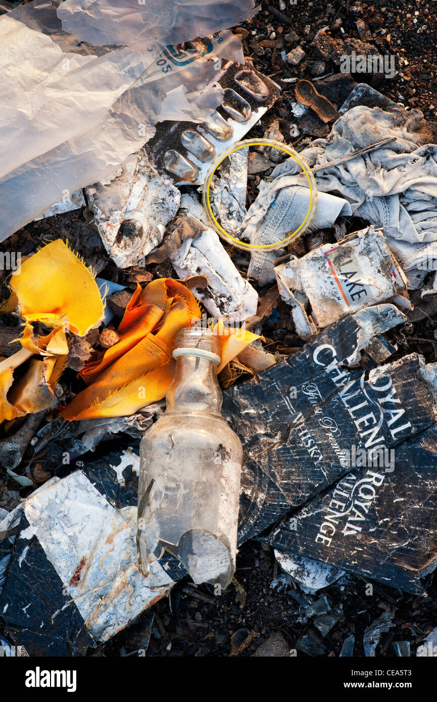 Discarded household waste in the Indian countryside, representing the concept of Indian family social issues. Andhra Pradesh, India Stock Photo