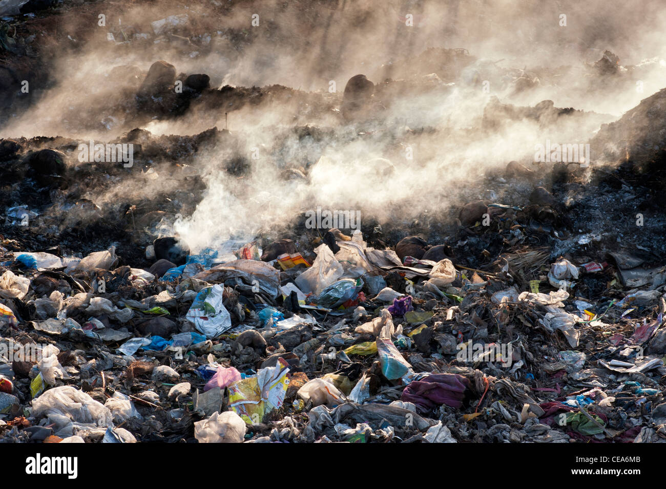Household waste being burnt on the roadside in India Stock Photo