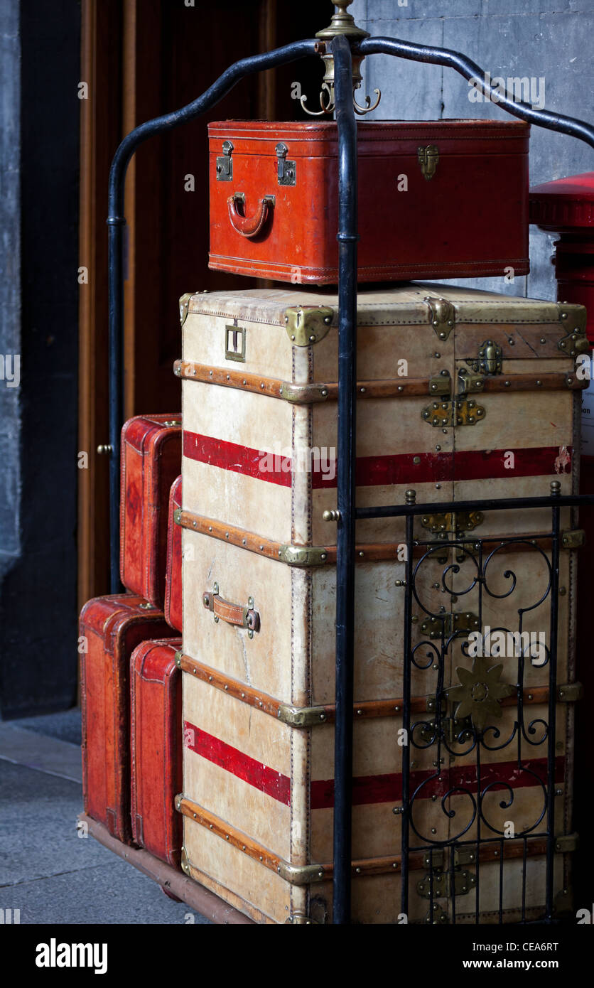 Vintage luggage on baggage trolley on film set Edinburgh Scotland UK Stock Photo