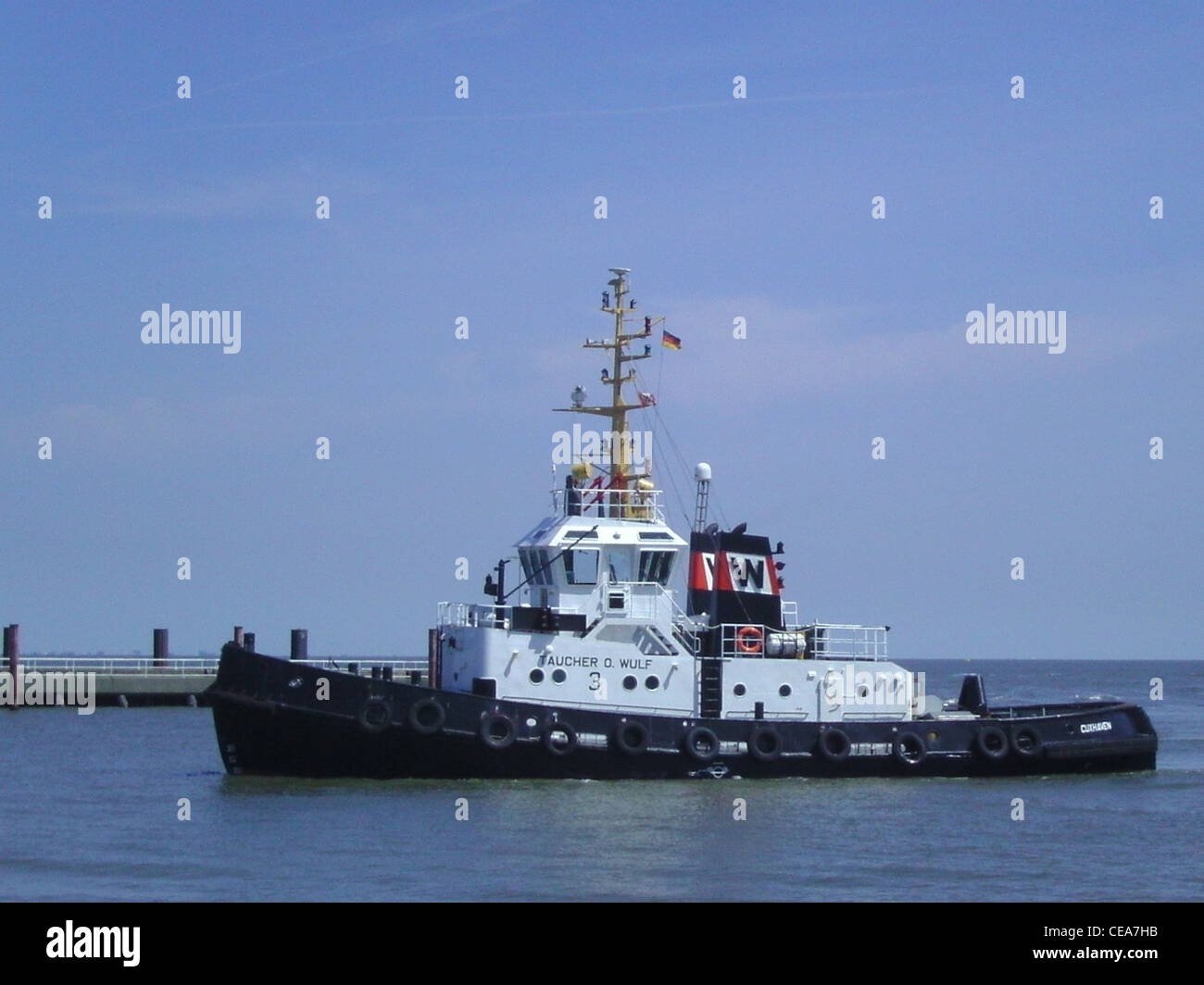 The tugboat Taucher O. Wulf 3 in the port of Cuxhaven Stock Photo