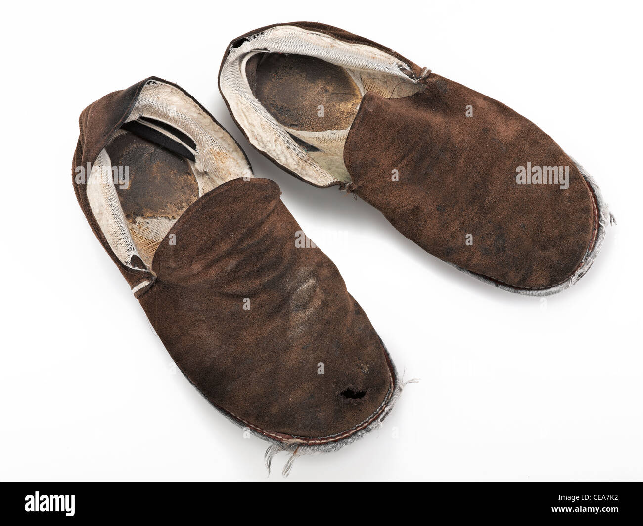 A pair of old, ratty house slippers on a white background Stock Photo -  Alamy