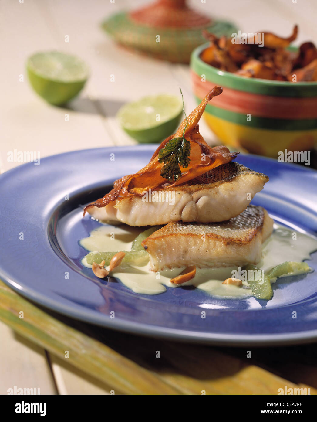 Fried pike - perch with lime - curry sauce and deep fried sweet potatoes Stock Photo