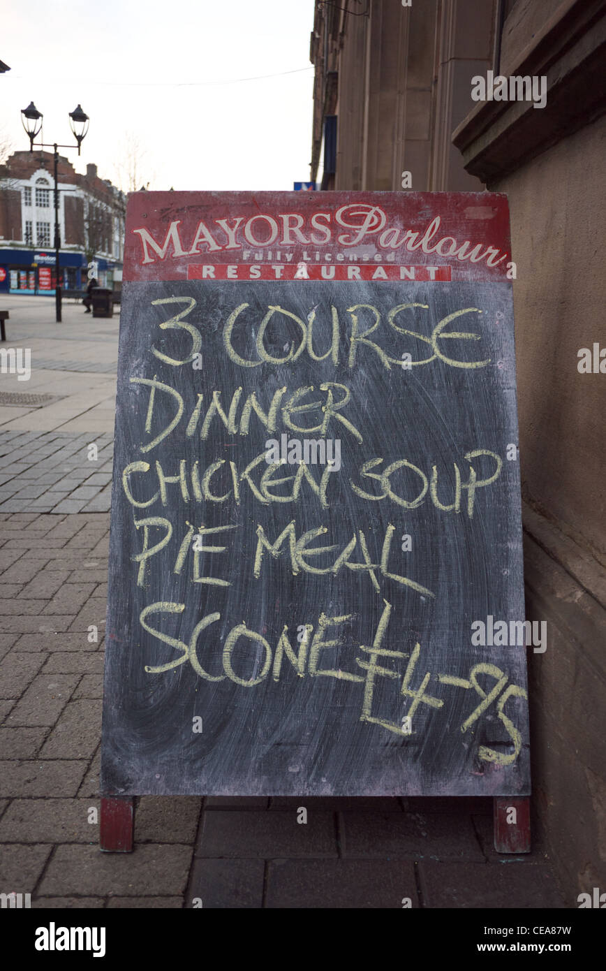 Sandwich board advertising cheap 3 course meal Stock Photo Alamy