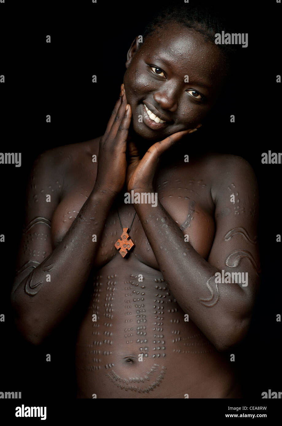 Naked Breasts Bodi Smiling Woman Portrait With Scarified Skin Omo Valley  Ethiopia Stock Photo - Alamy