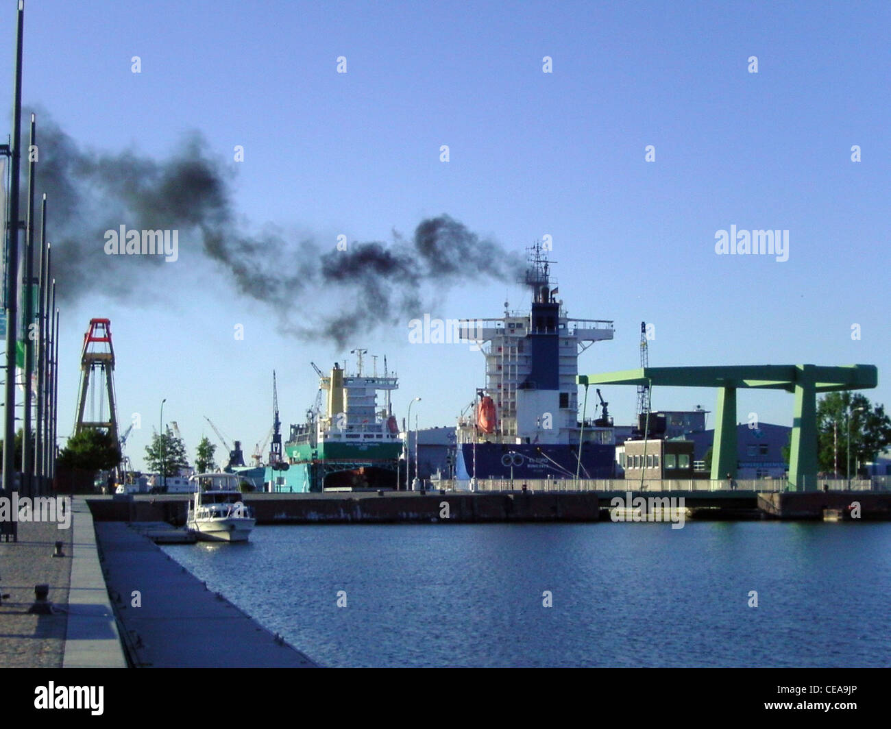 The cargo ship El Toro emitted some smoke while running up the engine Stock Photo