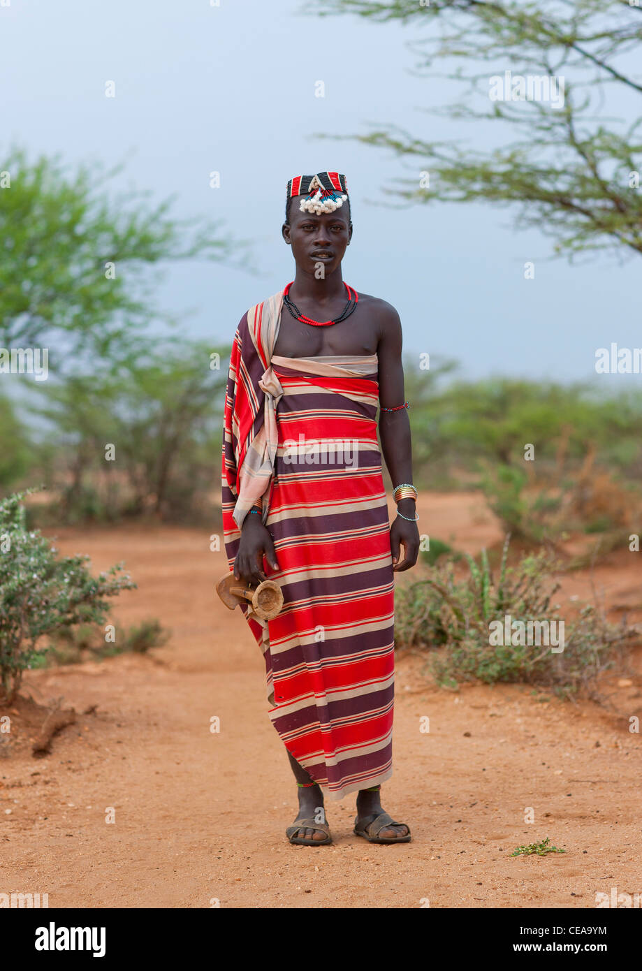 Hamer Man Dressed In Traditional Loincloth With Hat And Holding Headrest Omo Valley Ethiopia Stock Photo