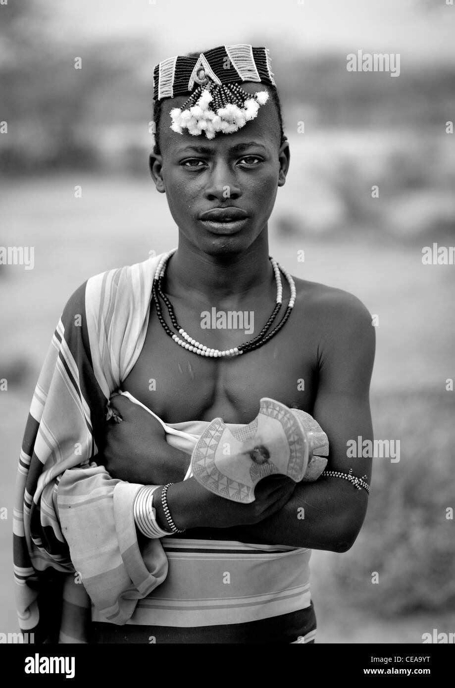 Hamer Man Dressed In Traditional Loincloth With Hat And Holding Headrest Omo Valley Ethiopia Stock Photo
