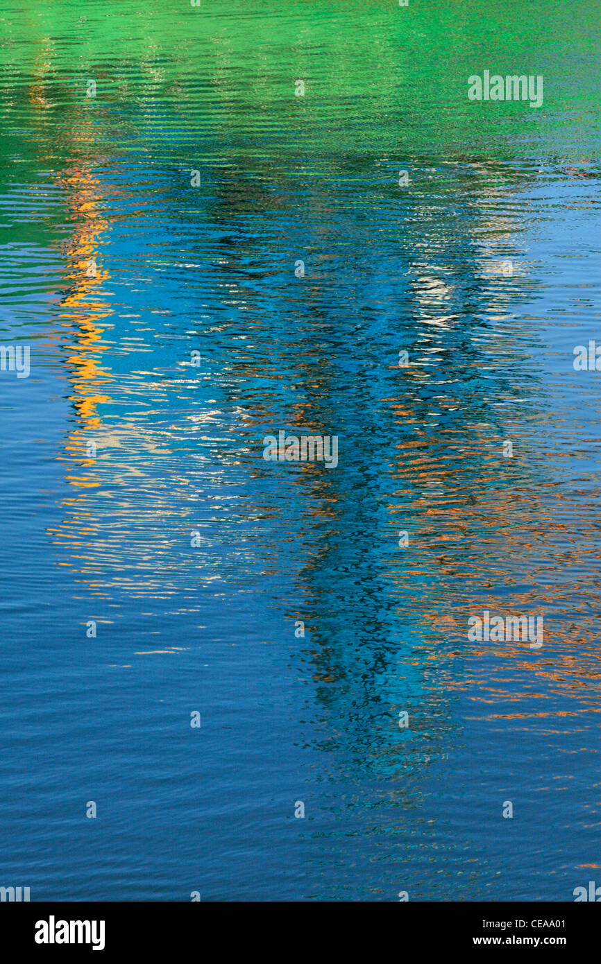 Reflections of a ship loading at Blythe Quay make for a brightly colored abstract Stock Photo