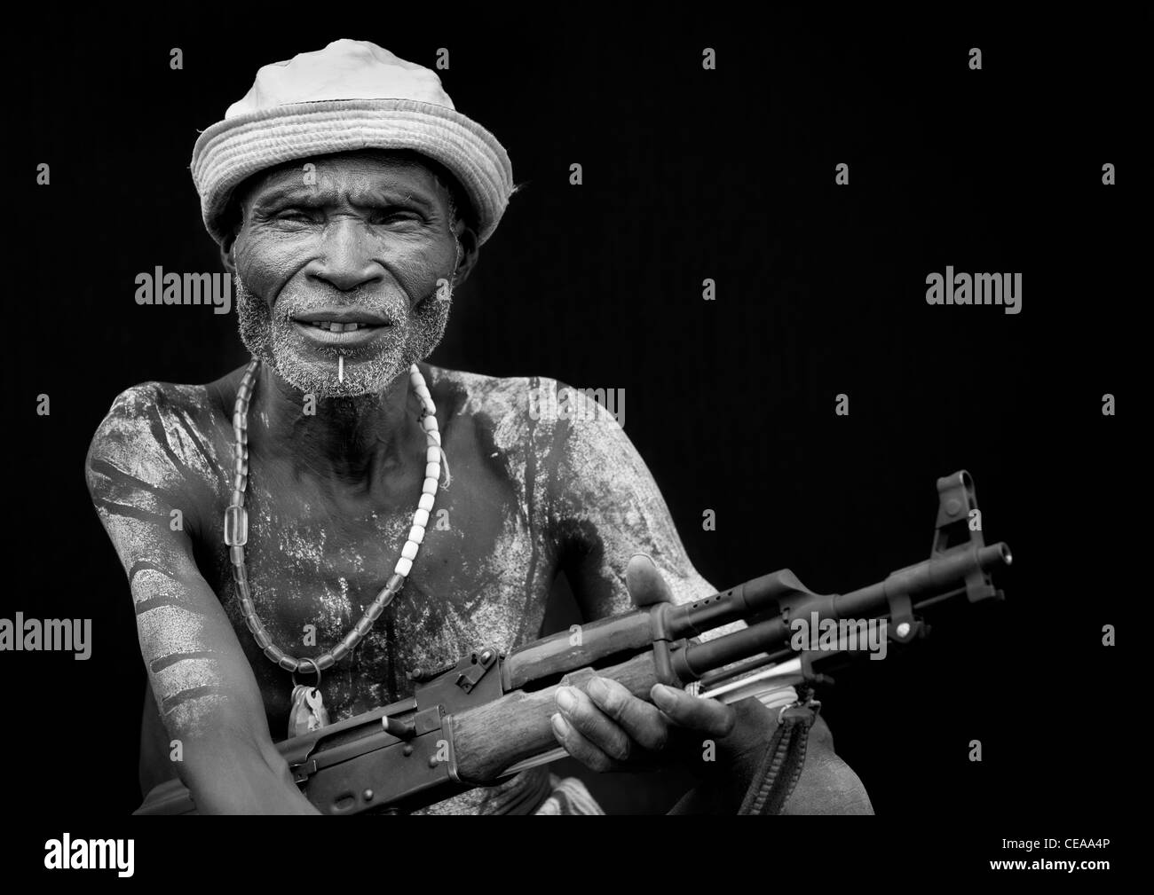 Senior Karo Man With Kalashnikov Rifle In Hand And Hat Ethiopia Stock Photo