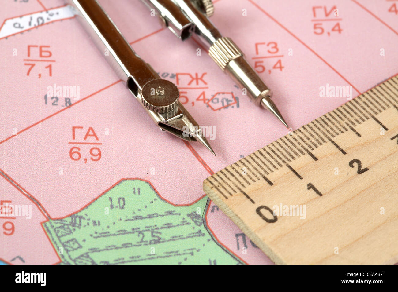 Topographic map of district with measuring instrument and ruler Stock Photo