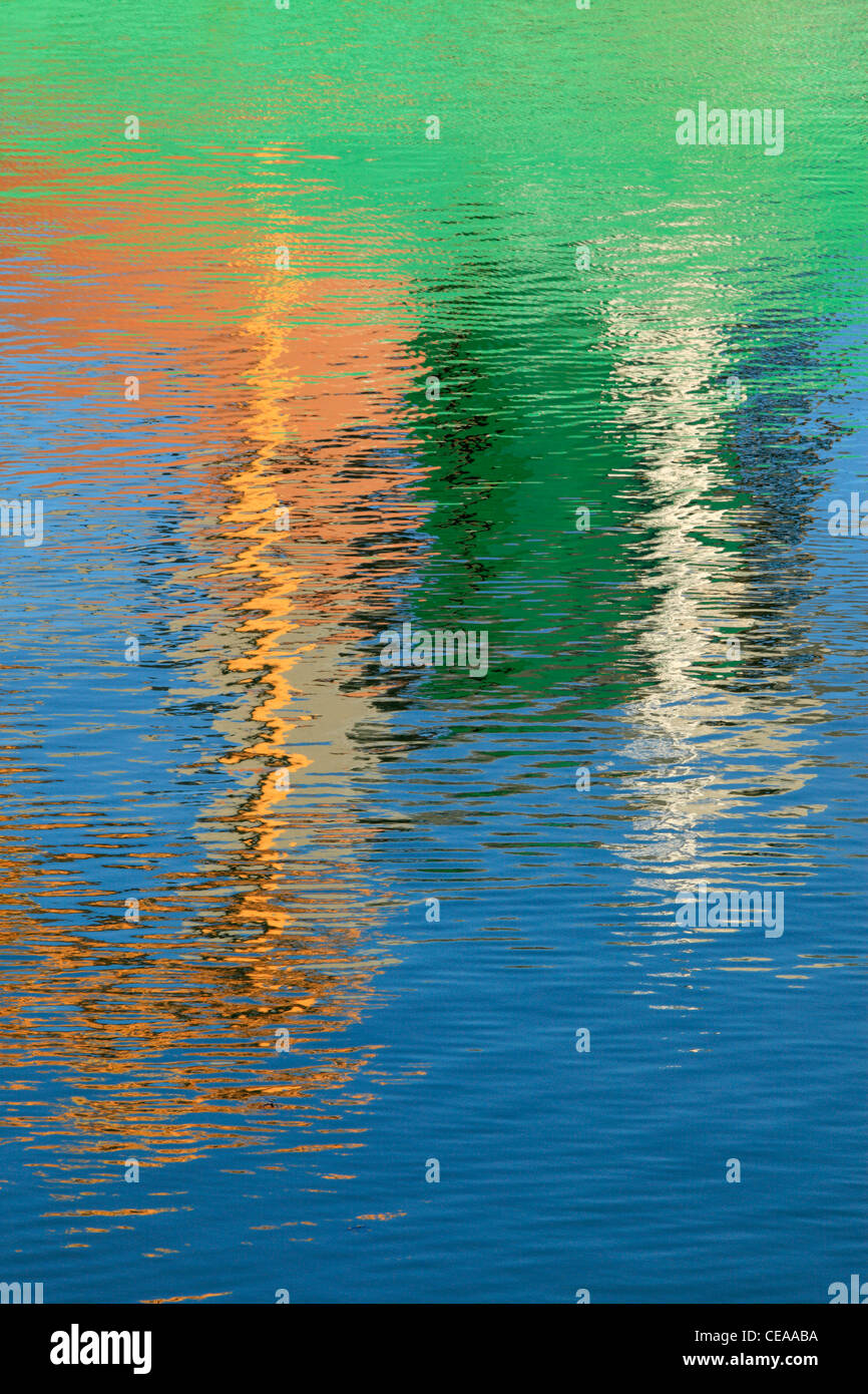 Reflections of a ship loading at Blythe Quay make for a brightly colored abstract Stock Photo