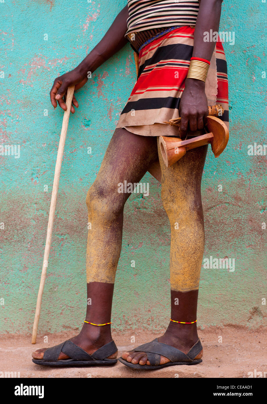 Legs Of Hamer Spread With Clay, Carrying Wood Stick And Headrest Omo Valley Ethiopia Stock Photo