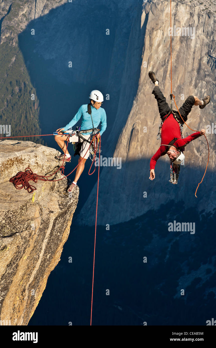 Climber in trouble at the end of his rope Stock Photo - Alamy