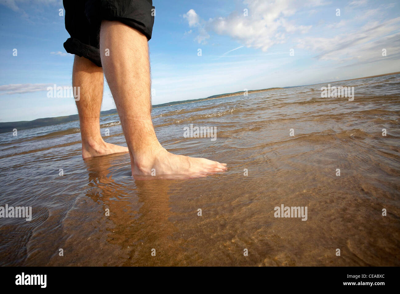 Feet getting wet in the sea Stock Photo Alamy