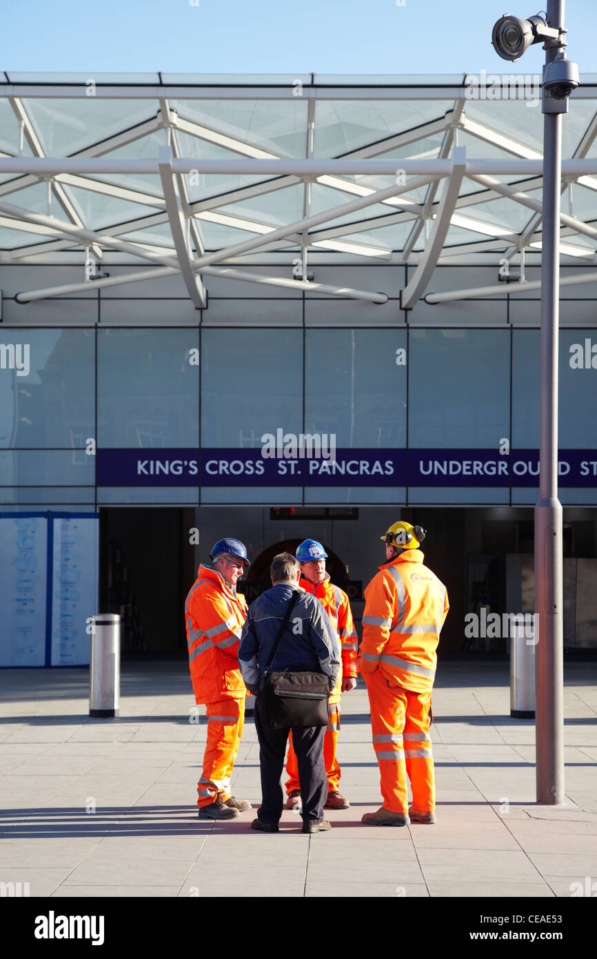 Construction workers in front the new King's Cross station entrance