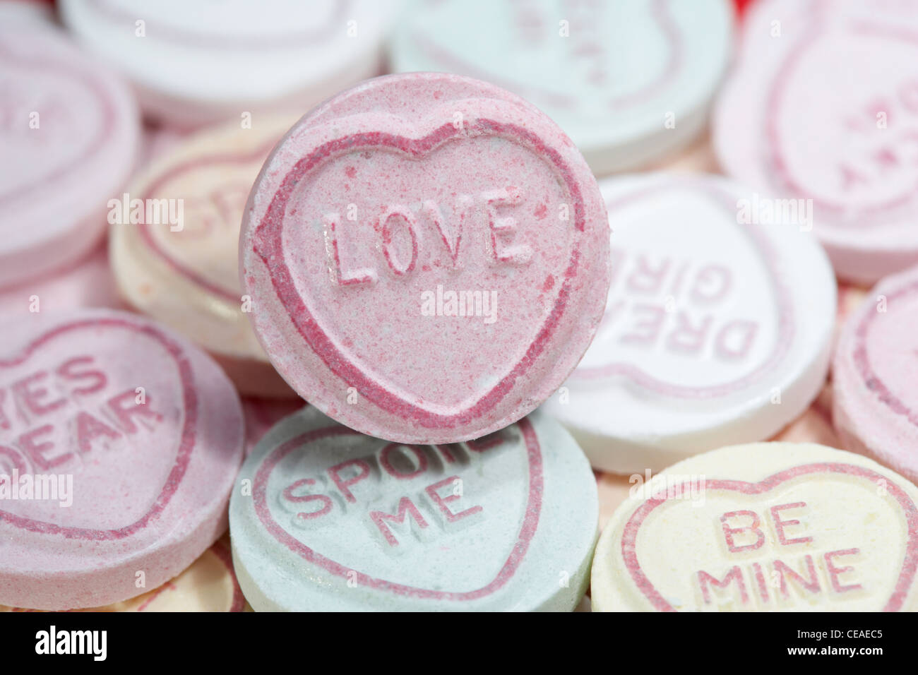 pink love amongst love heart sweets Stock Photo