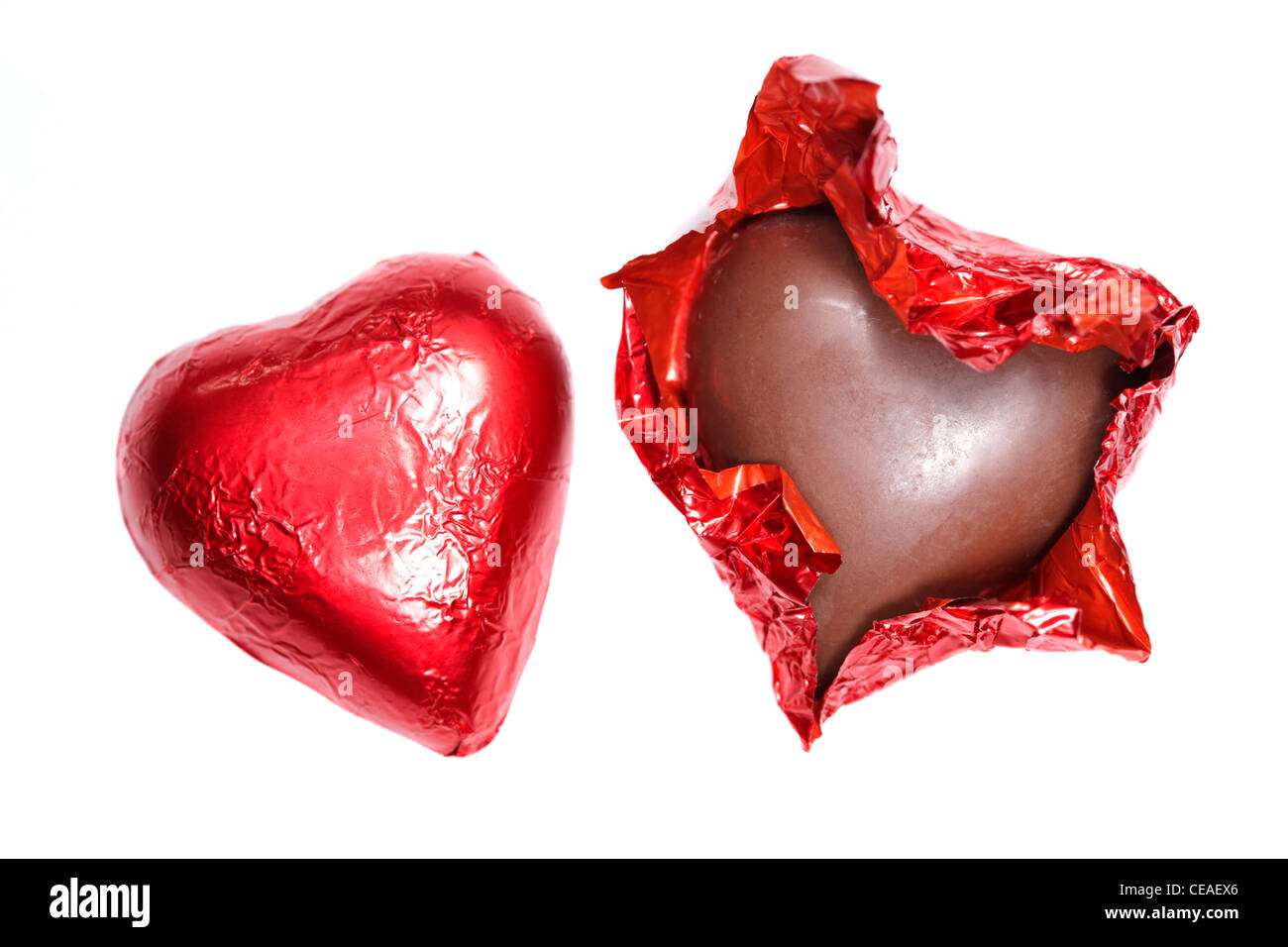 two chocolate hearts one unwrapped Stock Photo