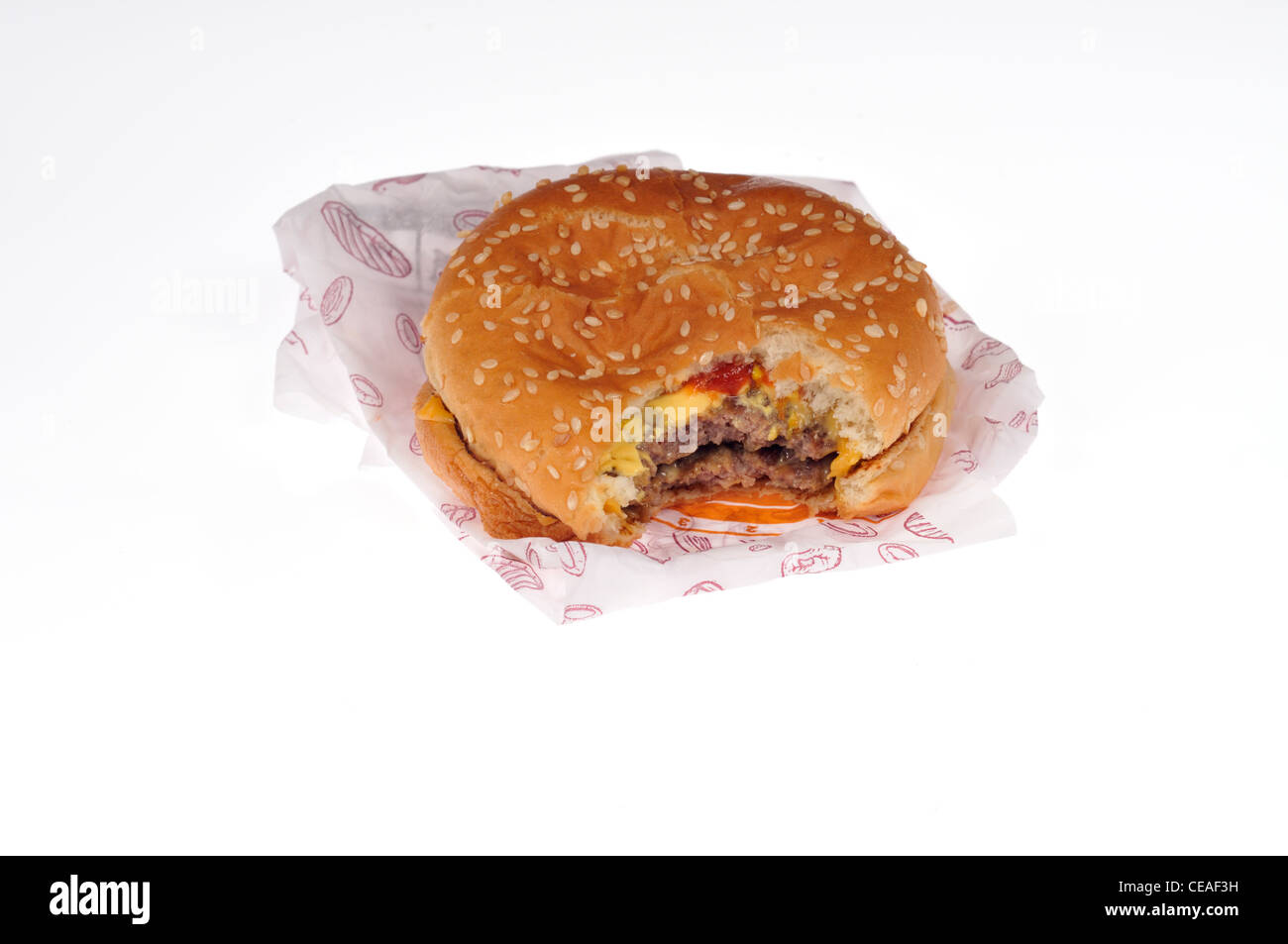 Burger King double cheeseburger with wrapper packaging on white background cutout. Stock Photo