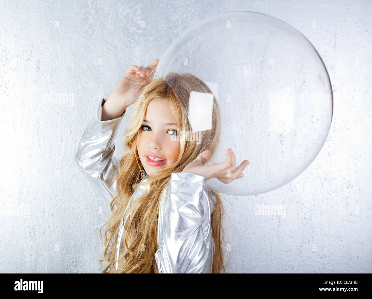 futuristic little girl with space suit Stock Photo