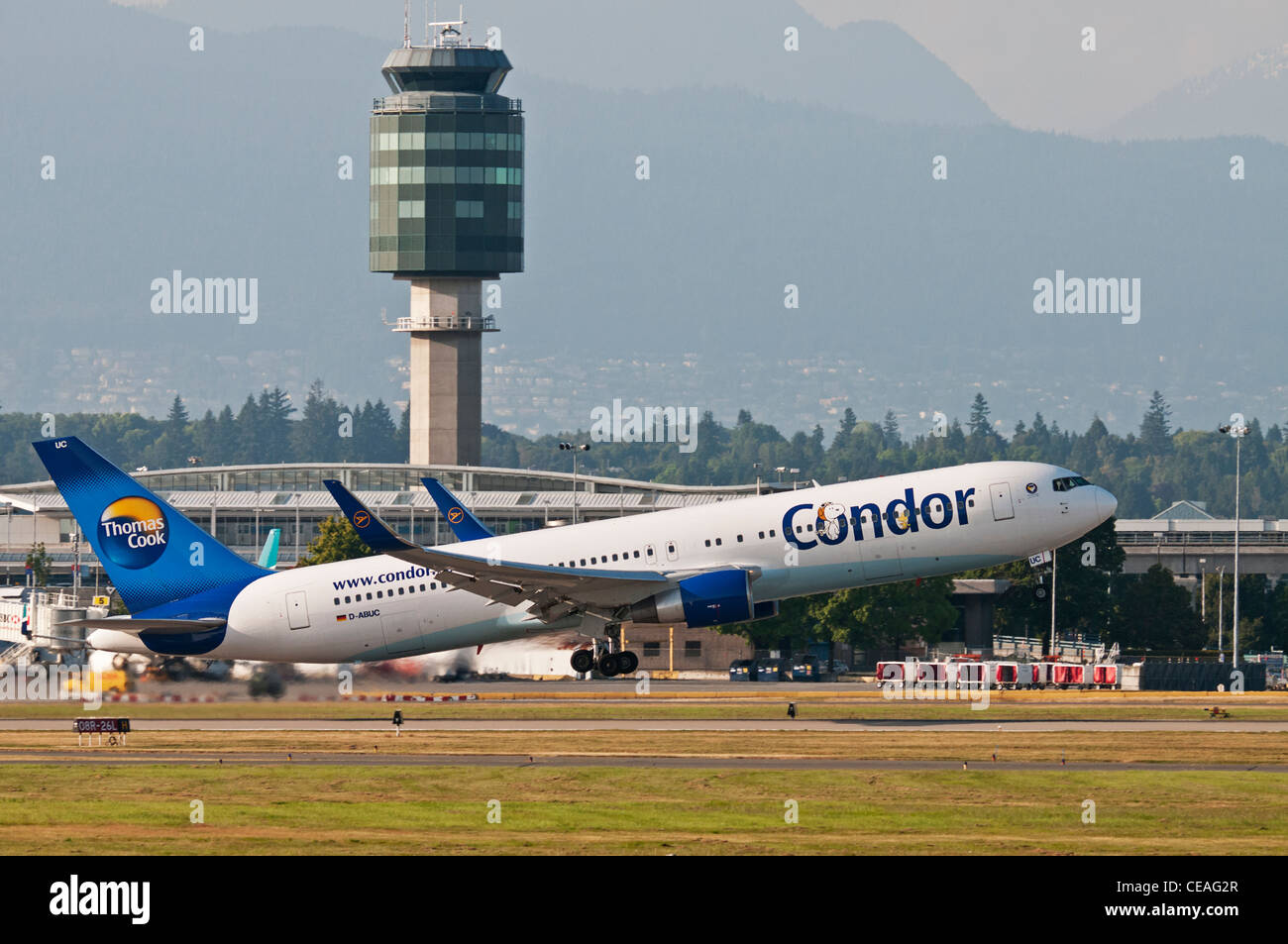 A Condor (Thomas Cook) Boeing 757 jetliner takes off from Vancouver International Airport. Stock Photo