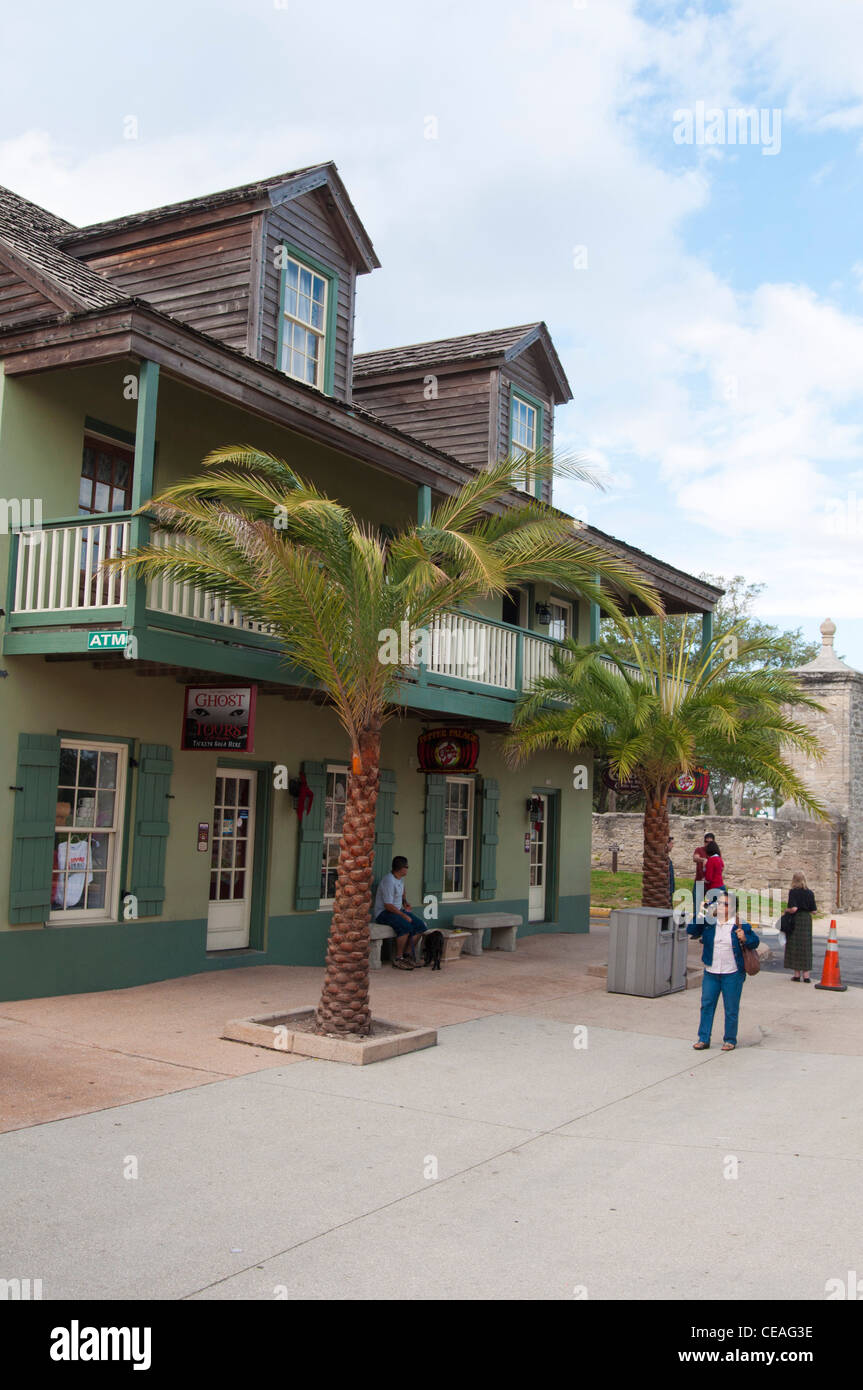 Palms and green building of 2 St. St with Pepper Palace shop and