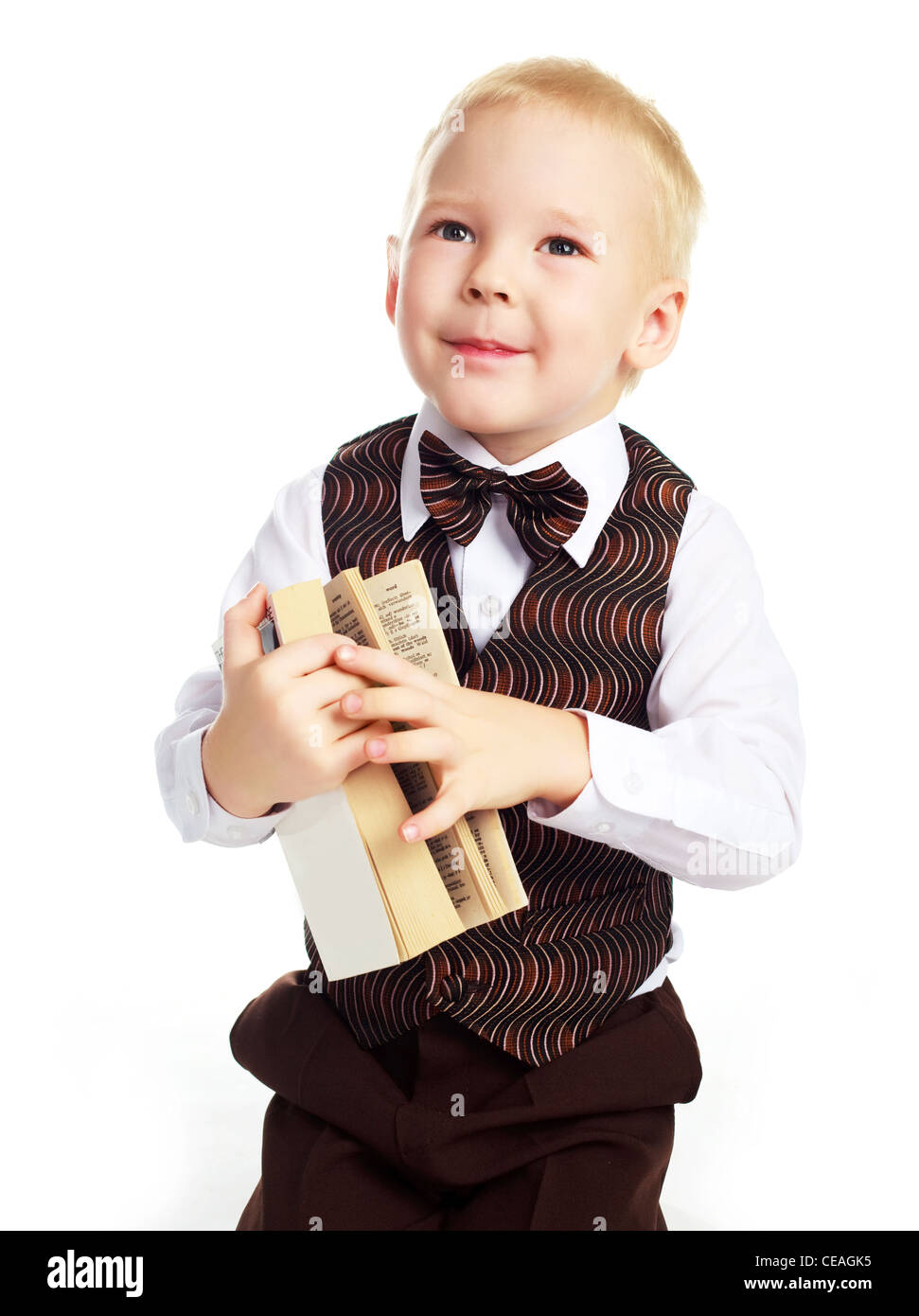 little boy with a book, isolated against white background Stock Photo ...