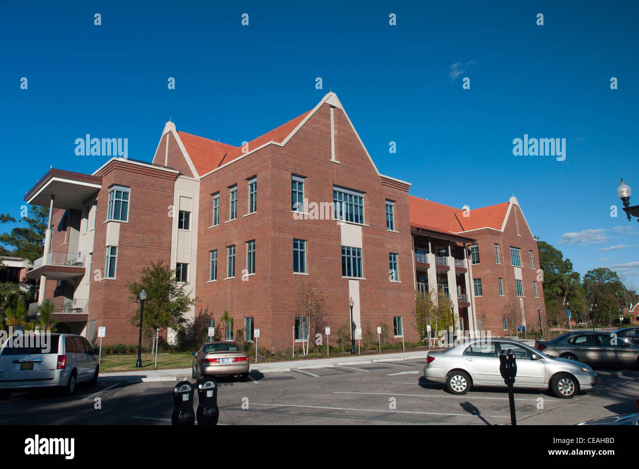 Parking lot and stylized red brick modern architecture. University of Florida, Gainesville, Florida, USA, United States, blue Stock Photo