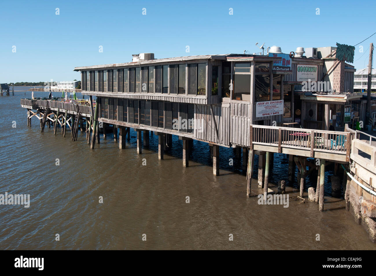Waterfront buildings on stilts in Cedar Key tourist town, Gulf of Mexico, Florida, United States, USA Stock Photo