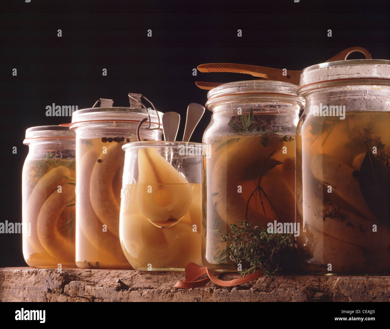 Still: Marinated sausages and vinegar - pears in glases Stock Photo