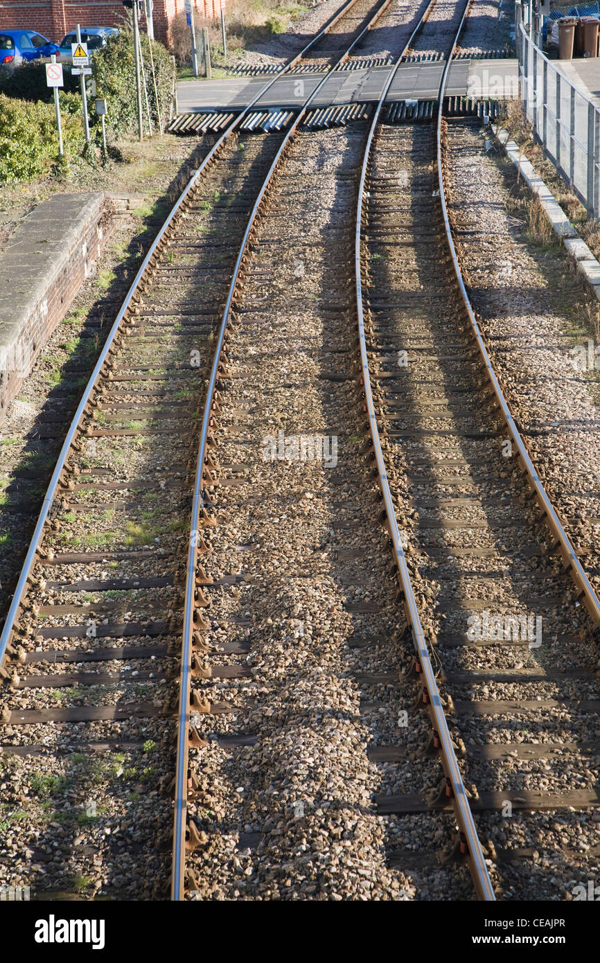Two railway lines and level crossing Stock Photo Alamy