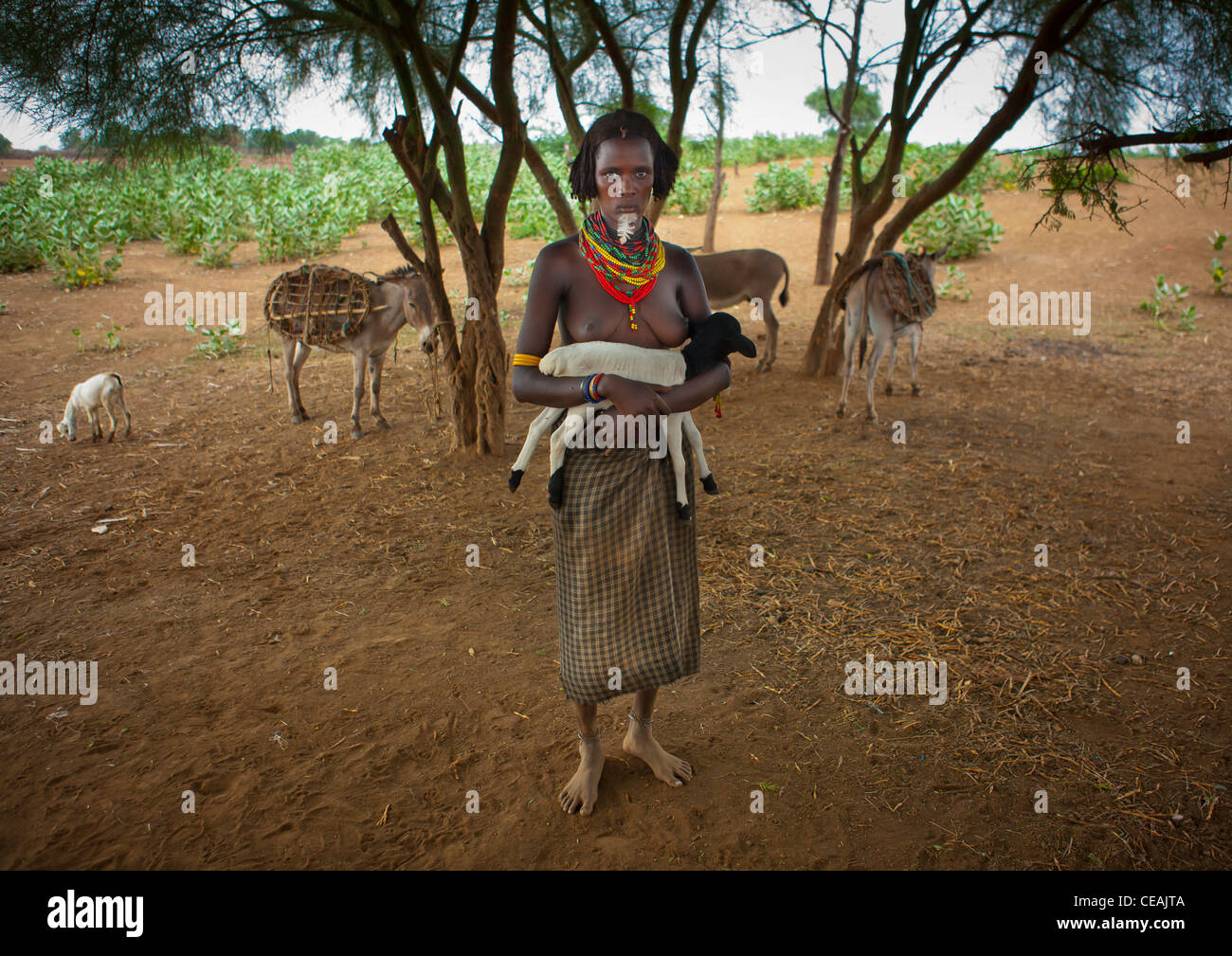 Beautiful Naked Breasts Dassanech Woman With Beaded Necklaces And Black