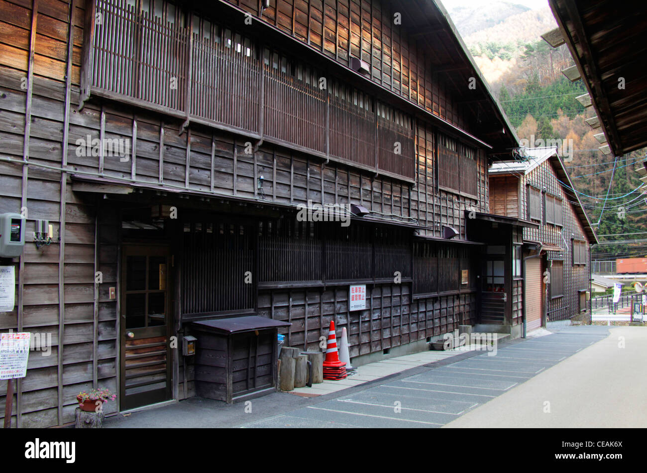 A house with a wooden wall and lattice windows at Narai-juku Nagano Japan Stock Photo