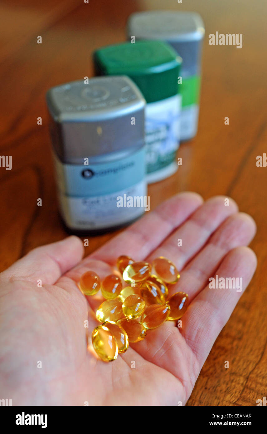 Handful of Cod Liver oil vitamin capsules for healthy joints and