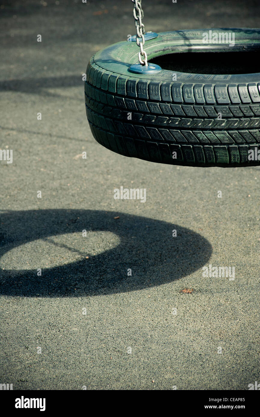 Empty swing at playground Stock Photo