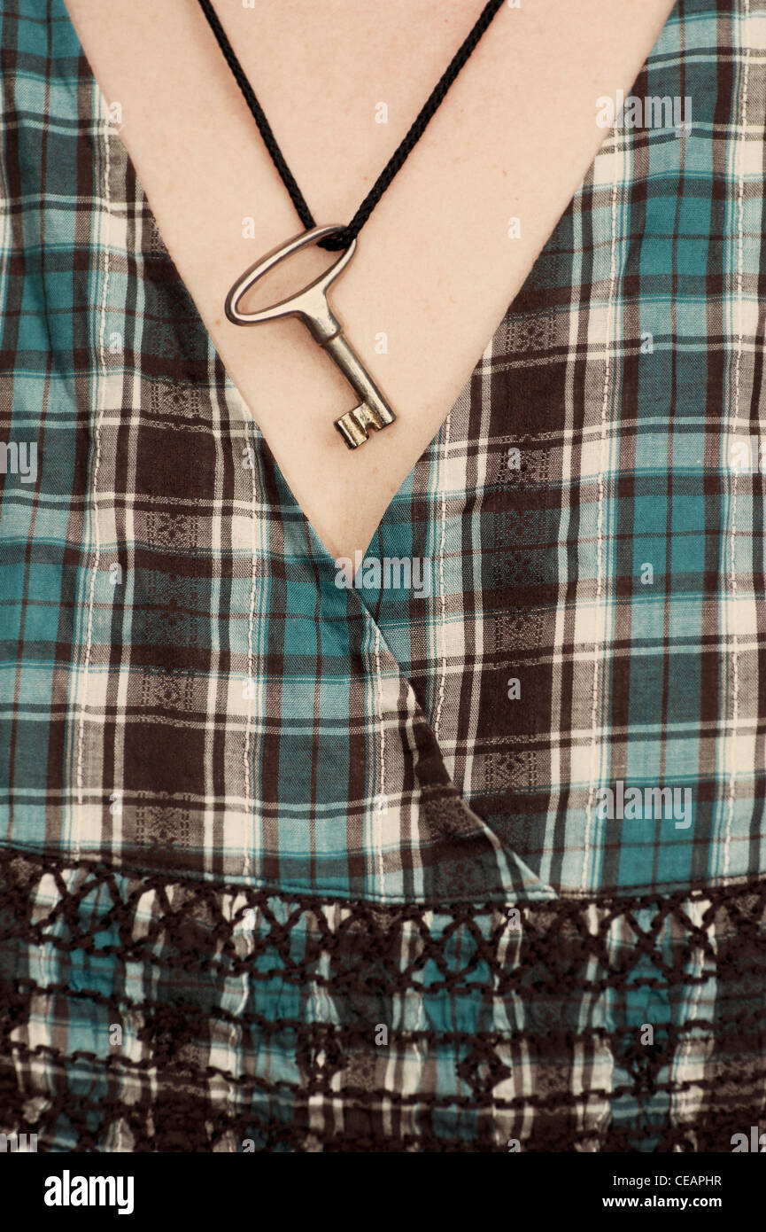 Woman wearing a key around her neck Stock Photo Alamy