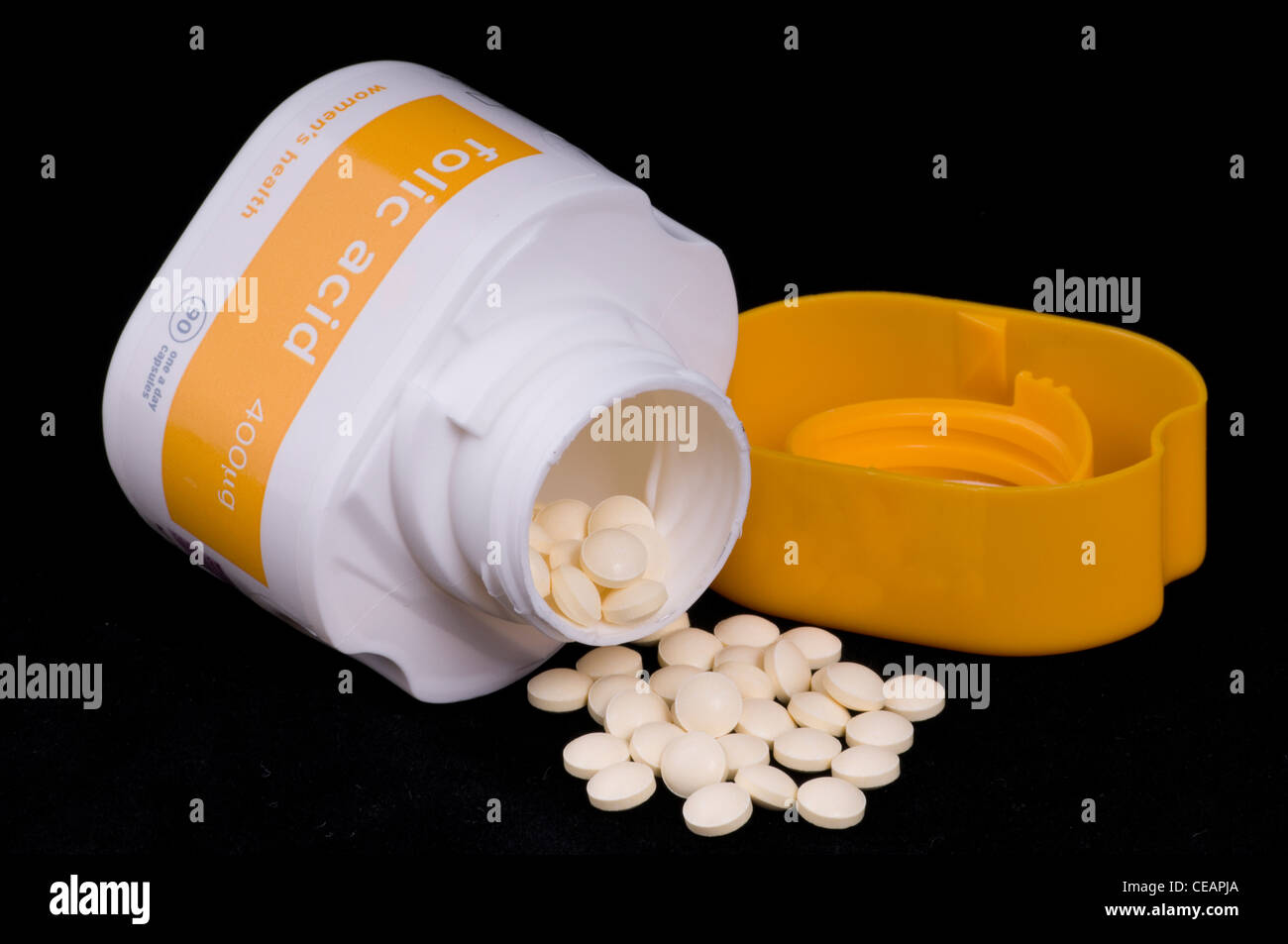 folic acid isolated on black vitamins for pregnancy Stock Photo