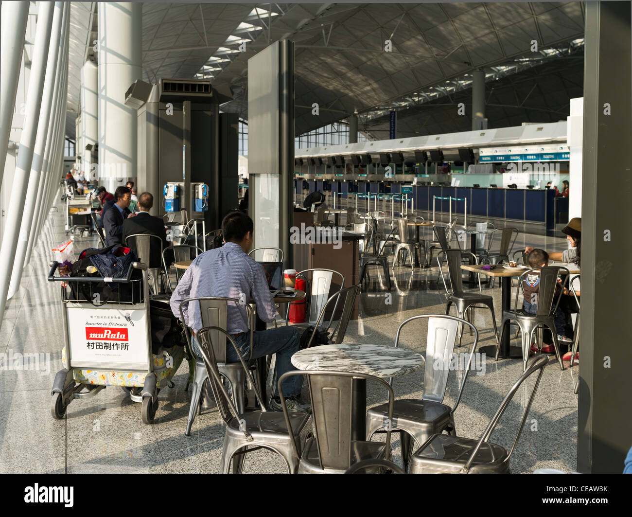 dh Hong Kong Airport CHEK LAP KOK HONG KONG Hong Kong International Airport Terminal 1 Cathay Pacific departures lounge passengers people hk Stock Photo