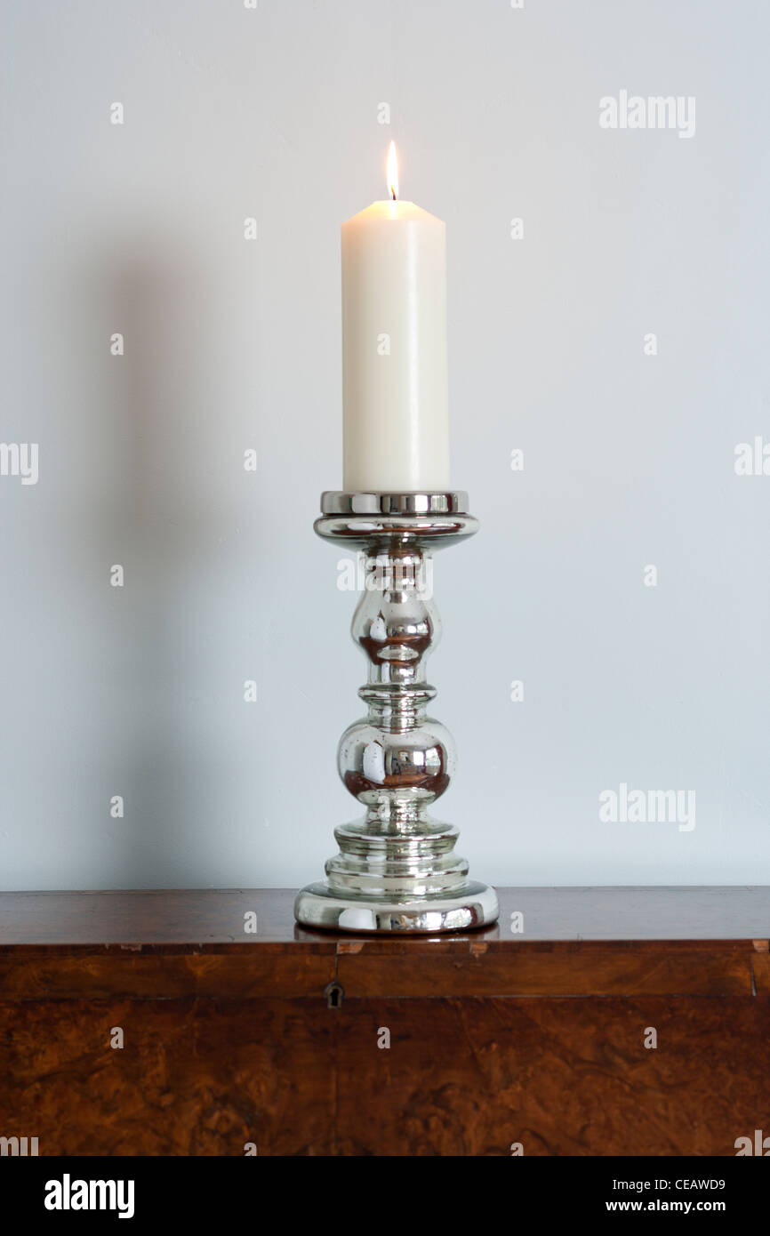 One Candle on a candlestick Stock Photo