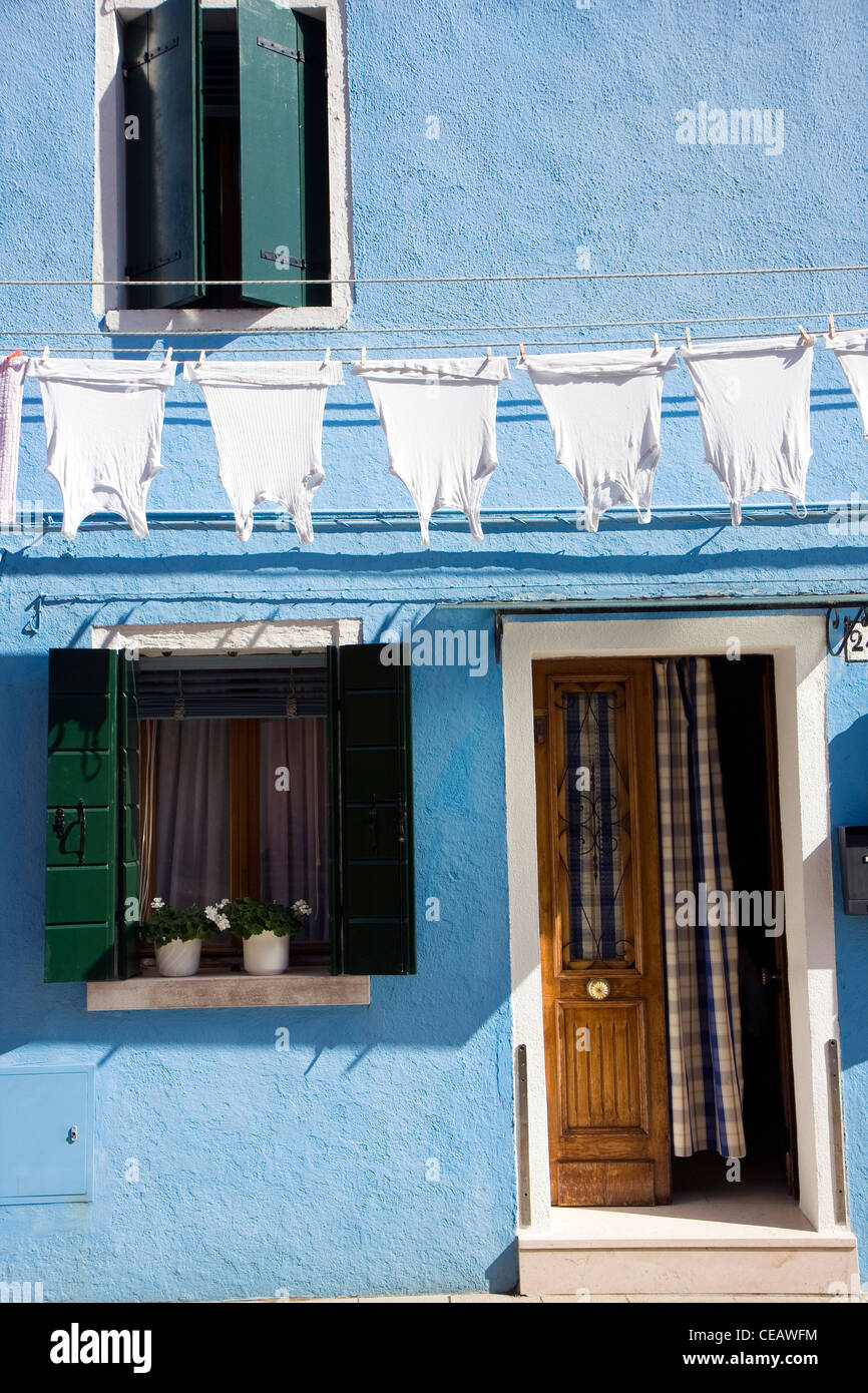 Typical Italian house at Burano Island next to Venice with windows and ...