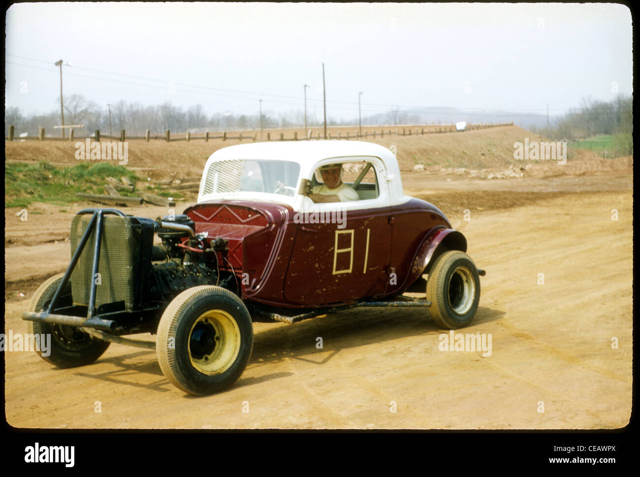 Hot rod, stock car parked outside dirt race track in 1958 1950s americana united states Stock Photo