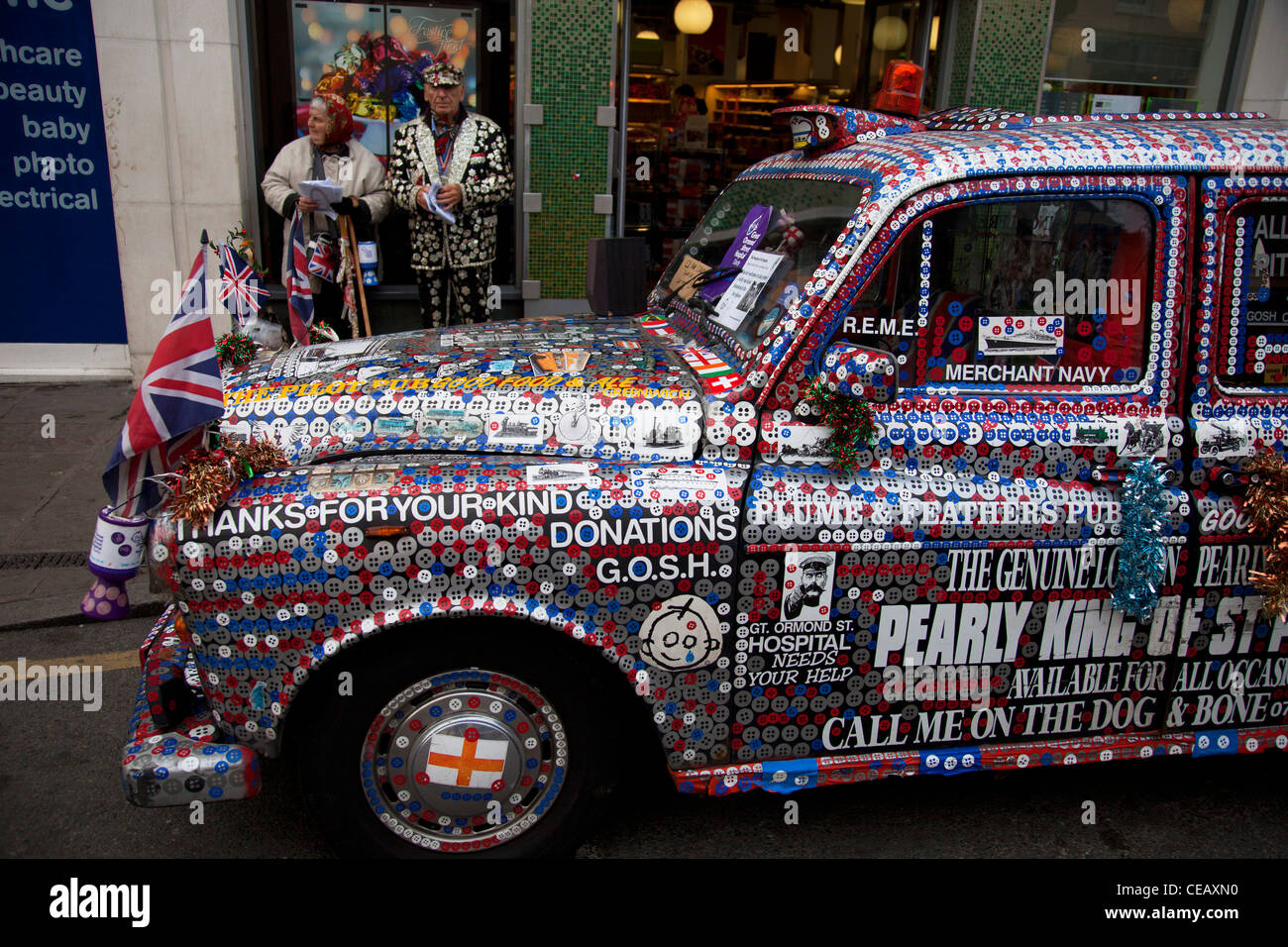 Pearly King of St Pancras with his Pearly taxi cab. Pearly Kings and Queens in London. Seen here in Greenwich, and known as pearlies, they are an organised charitable tradition of working class culture in London, England. Stock Photo