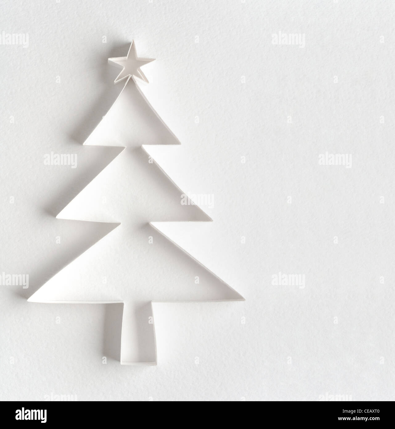 Christmas tree made of paper on white background Stock Photo - Alamy