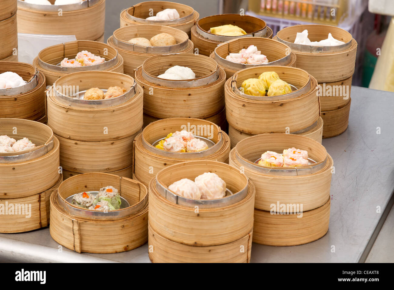 Steamed Dim Sum in Bamboo Trays by Local Street Food Vendors in Melaka Malaysia Stock Photo