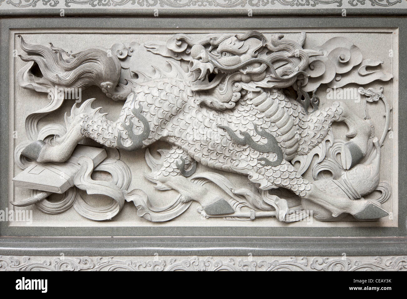 Stone Carving of Qilin on Chinese Temple Wall in Chinatown Stock Photo -  Alamy