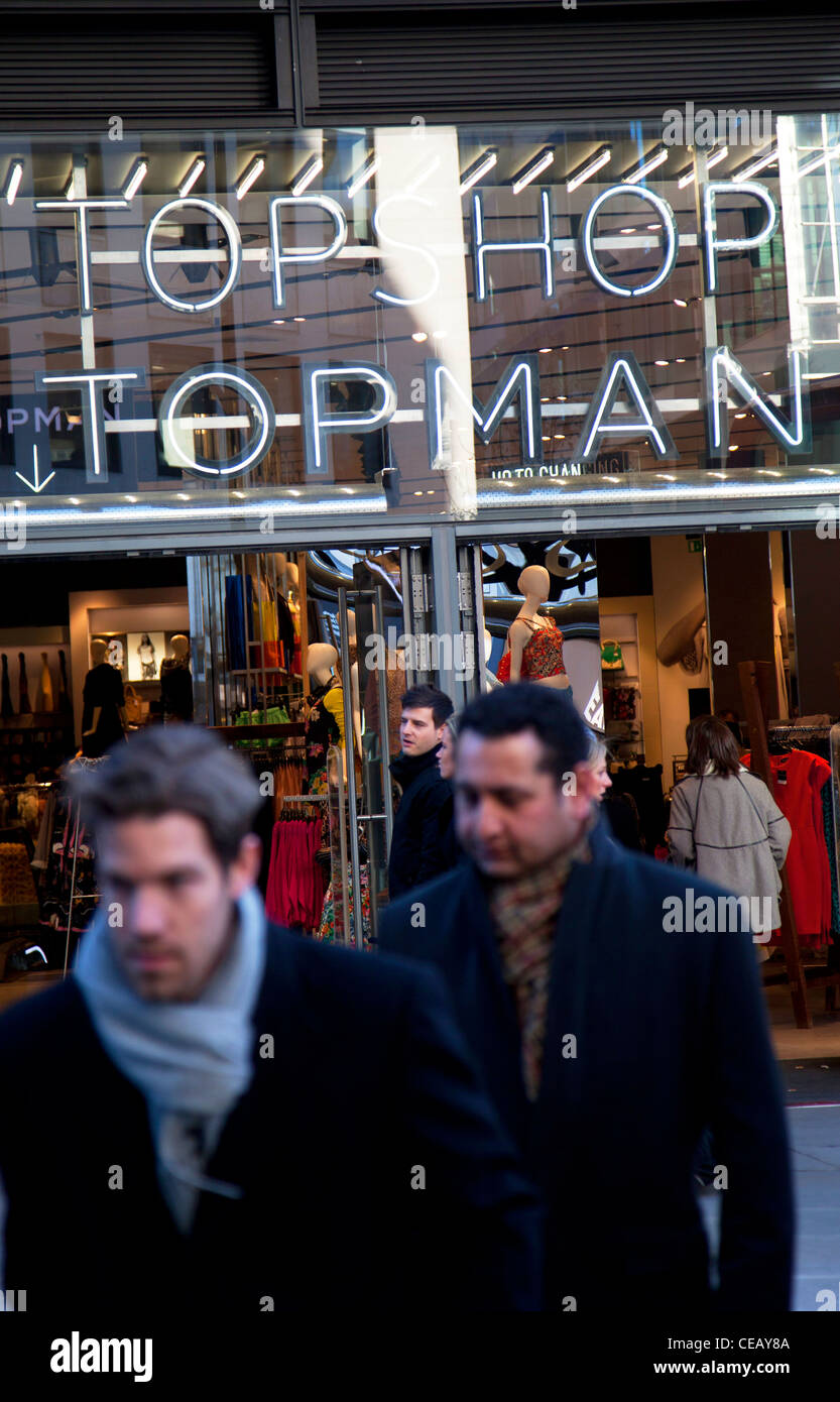 Men walking past a Topman / Topshop store in London. Topshop is a very  popular high street shopping chain Stock Photo - Alamy