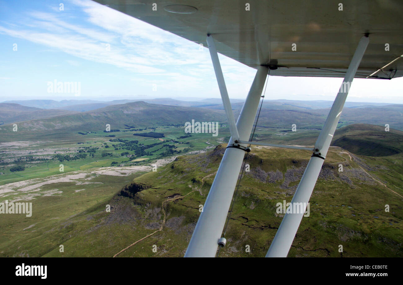 Aerial image of light aircraft wing and scenery beyond Stock Photo