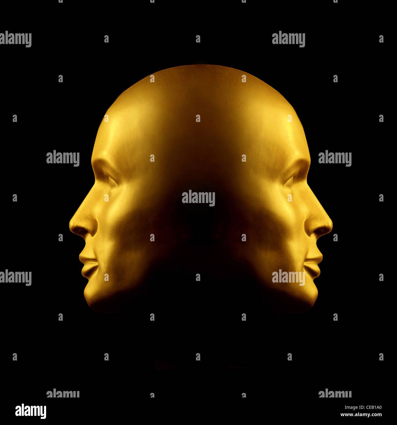 Two faced gold head statue against black Stock Photo Alamy