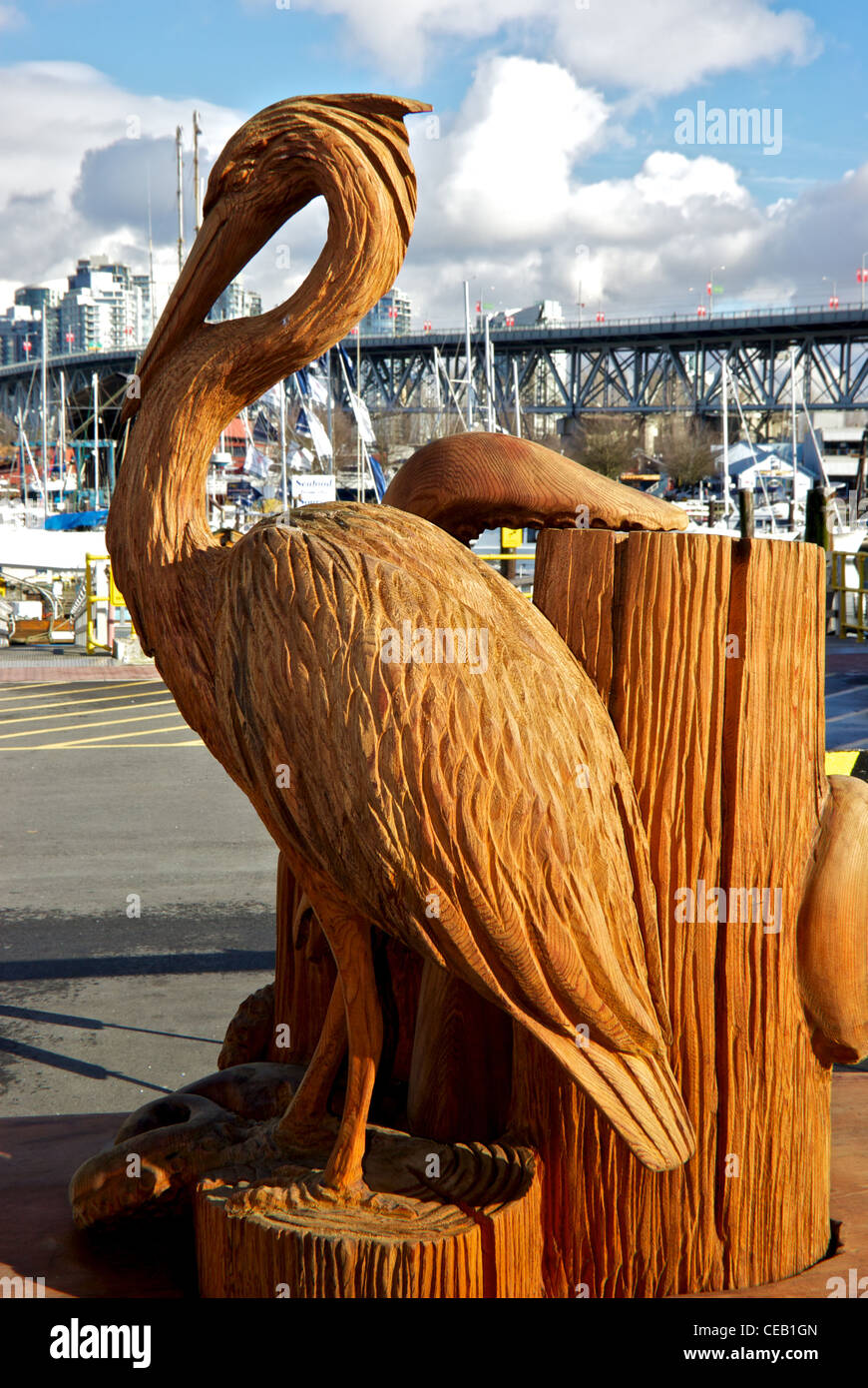 Carved wooden blue heron sculpture Vancouver False Creek waterfront