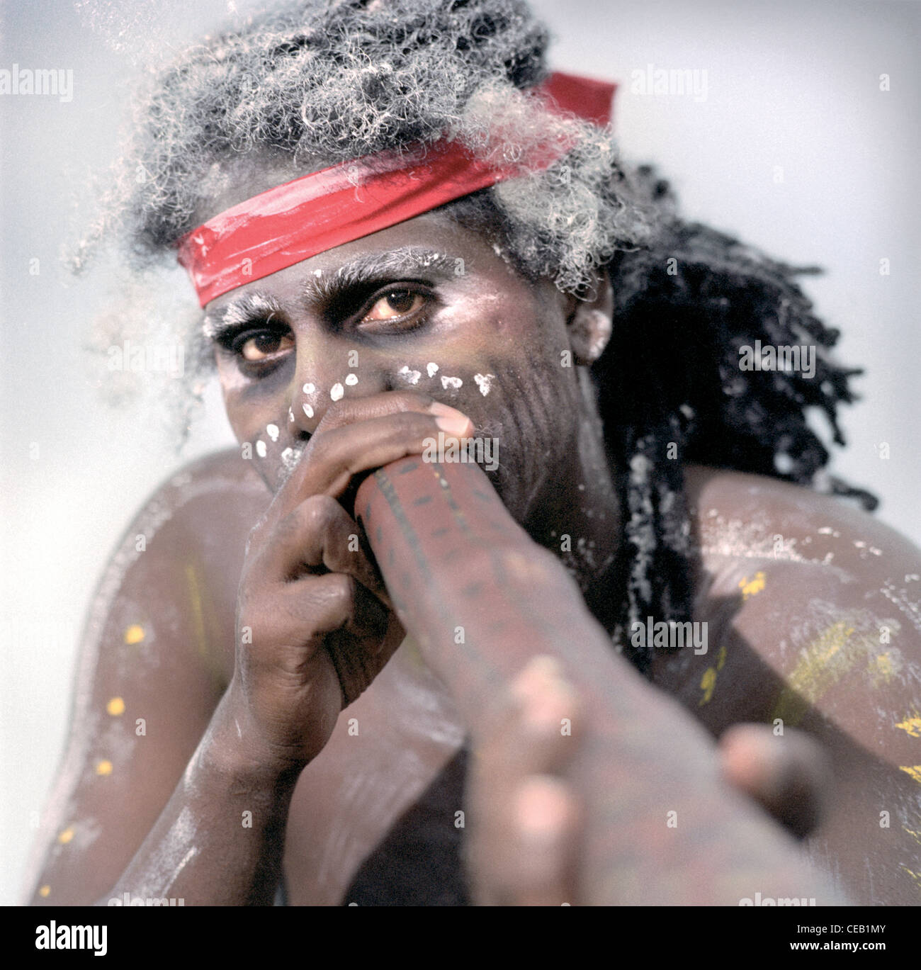 Aboriginal man playing a didgeridoo on a beach Stock Photo Alamy