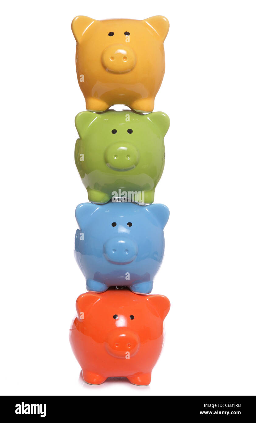 Piggy banks stacked on a white background Stock Photo - Alamy